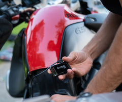 Cube GPS tracker mounted magnetically to truck frame